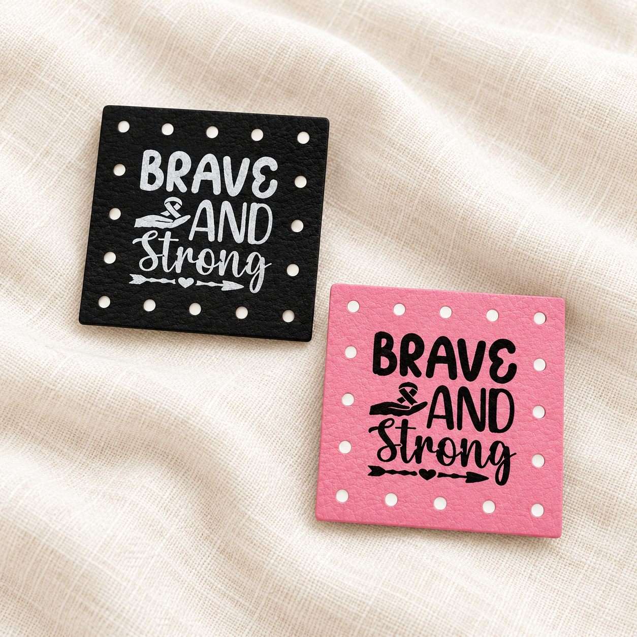 Brave and Strong engraved faux leather sew-on patches on a cream background