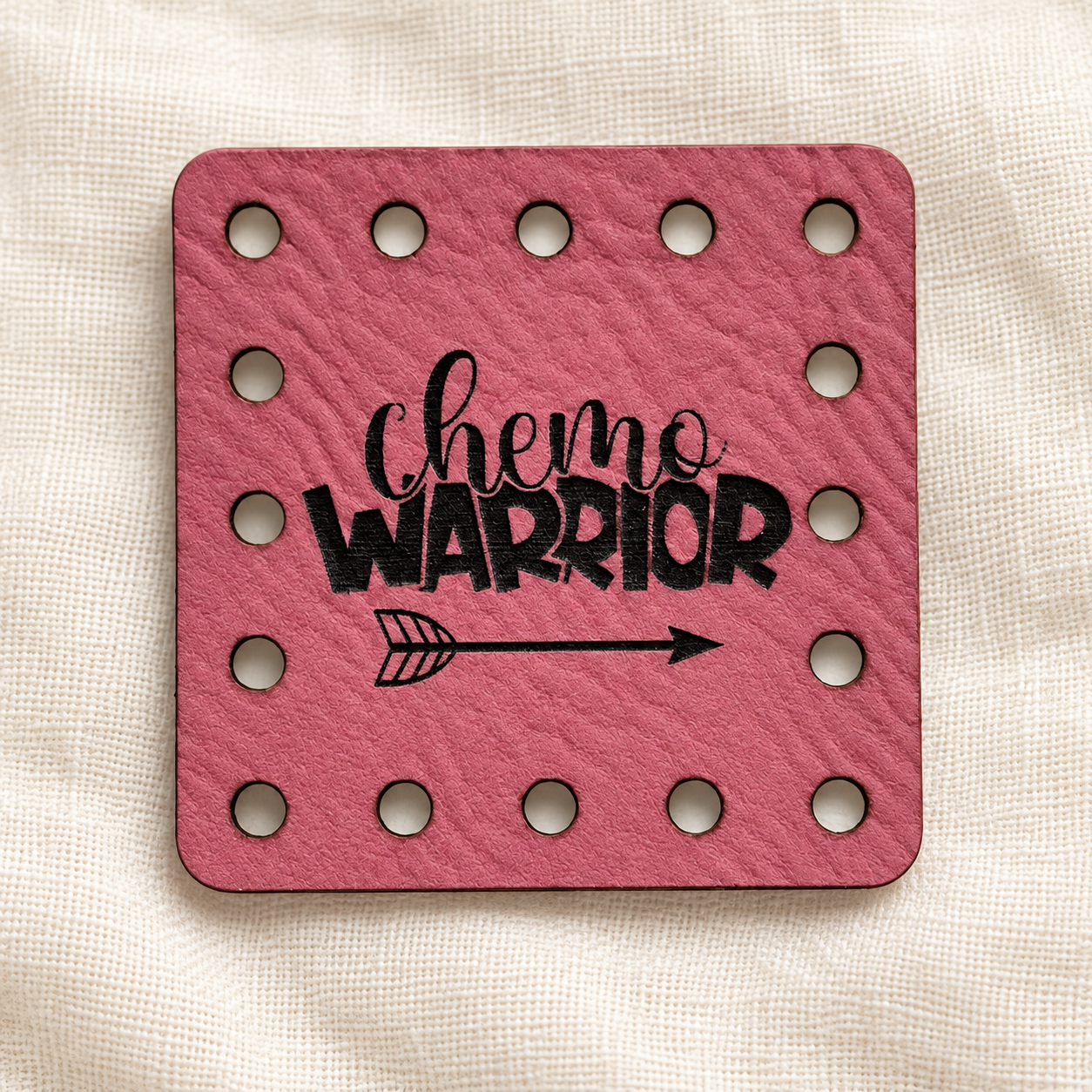 Chemo Warrior engraved faux leather sew-on patches on a cream background