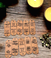 Ten assorted coffee sayings engraved on tan faux leather tags