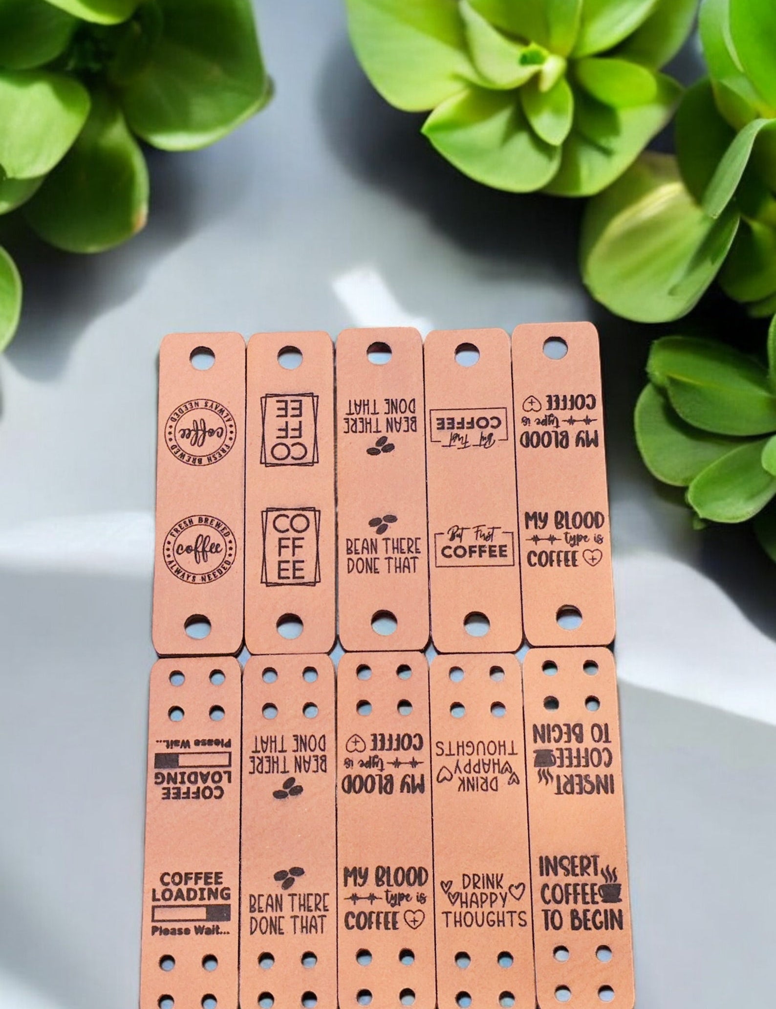 Ten coffee sayings on tan faux leather fold-over tags