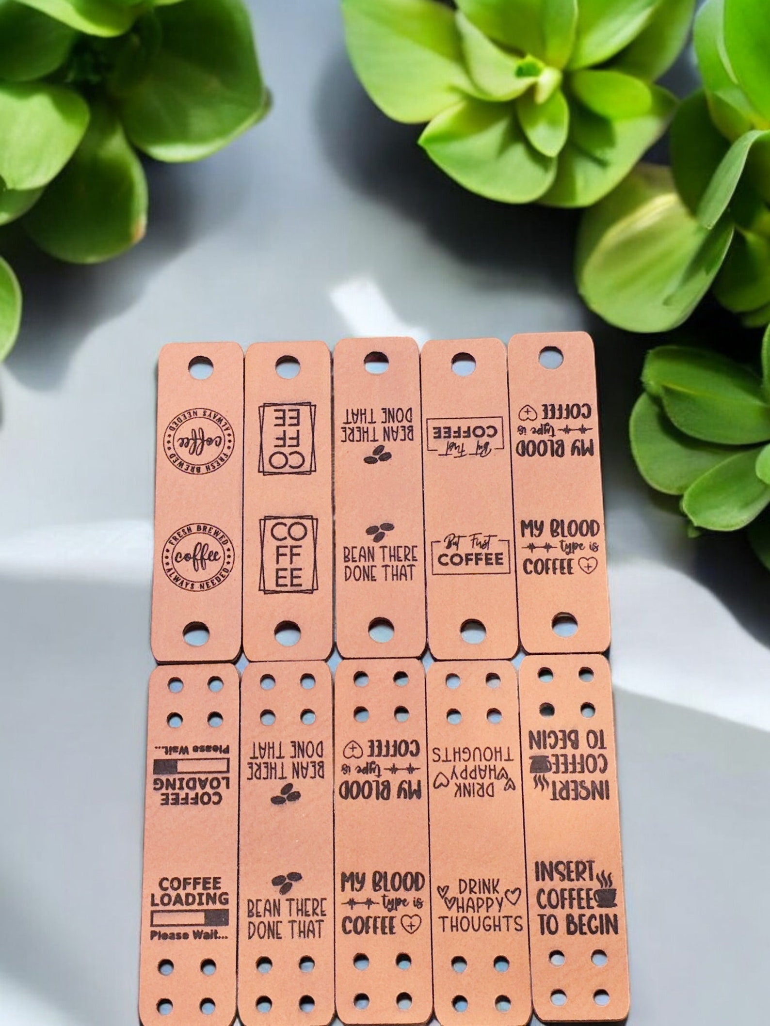 Ten coffee sayings on tan faux leather fold-over tags