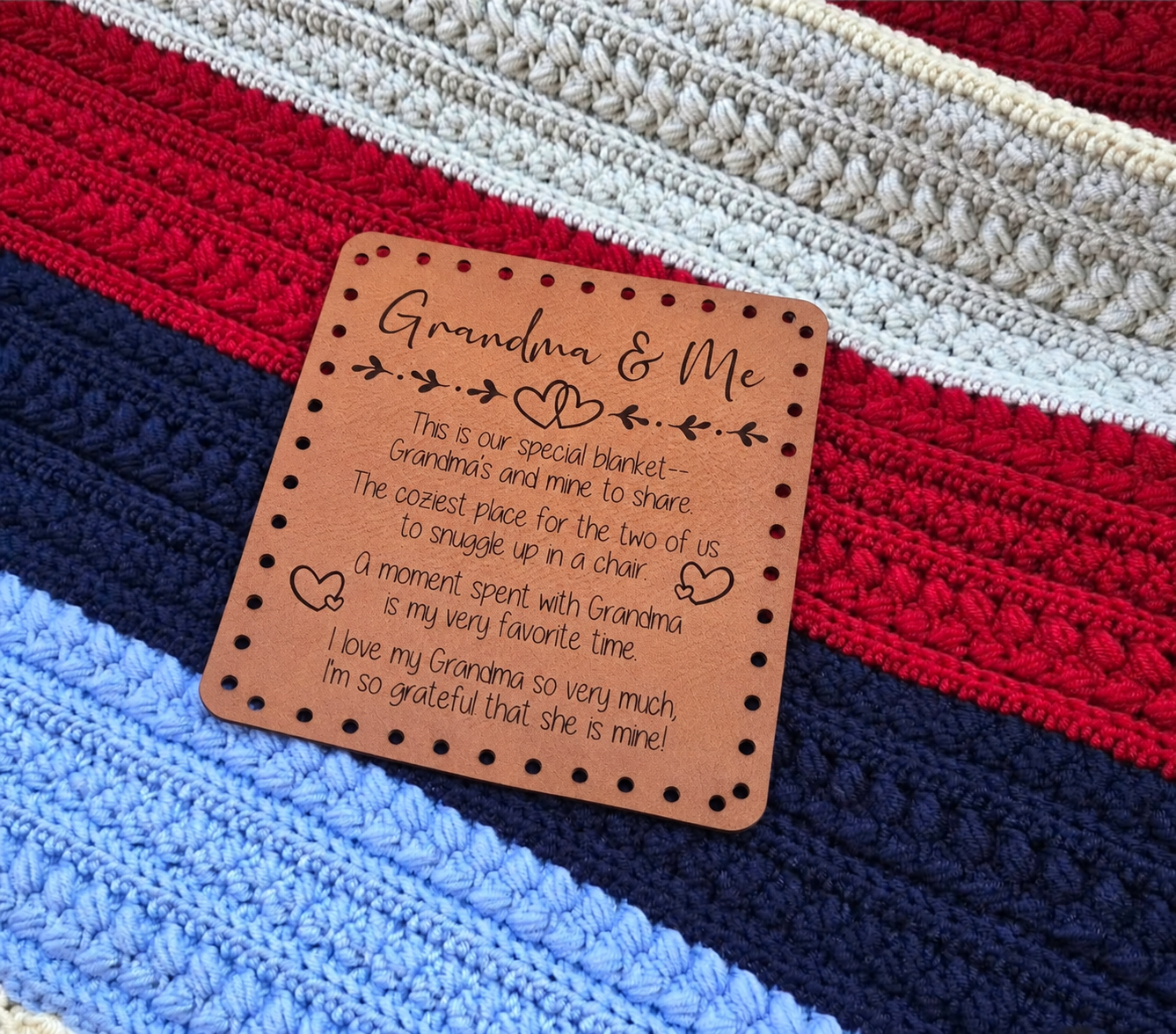 Illustrative close-up mockup of Grandma & Me patch resting on a striped crochet blanket