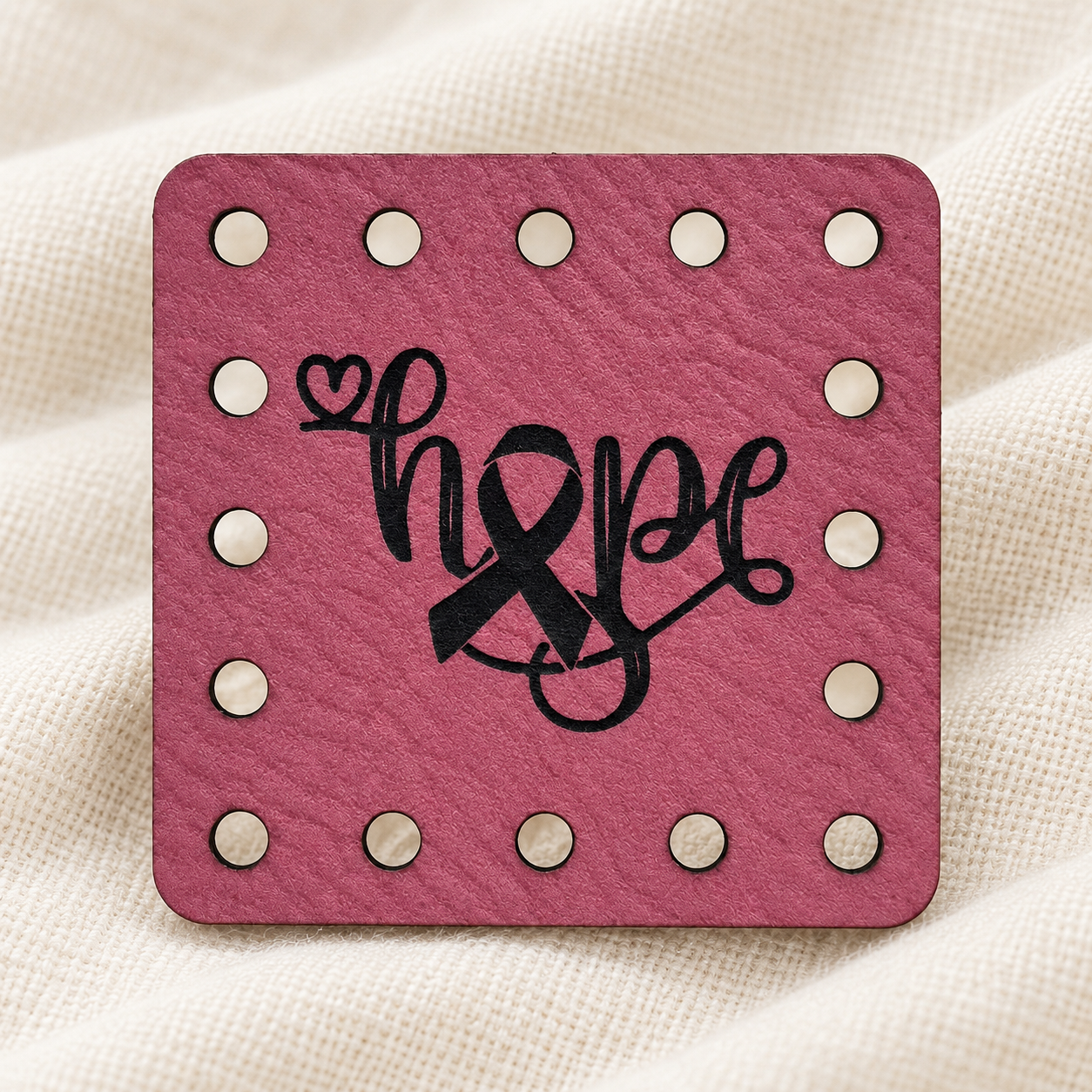 Hope engraved faux leather sew-on patches on a cream background