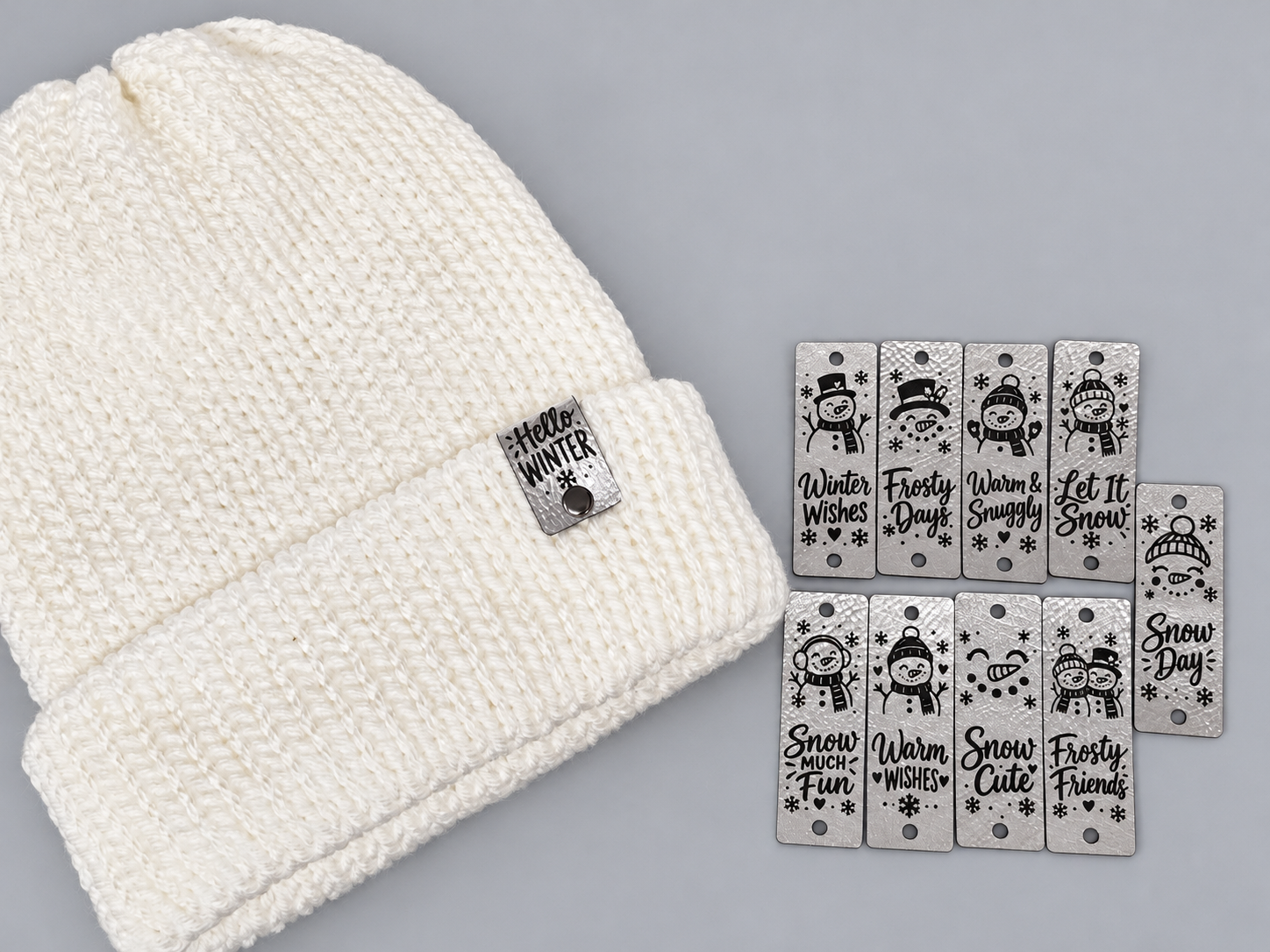 Silver winter snowman sayings tags with white knit beanie